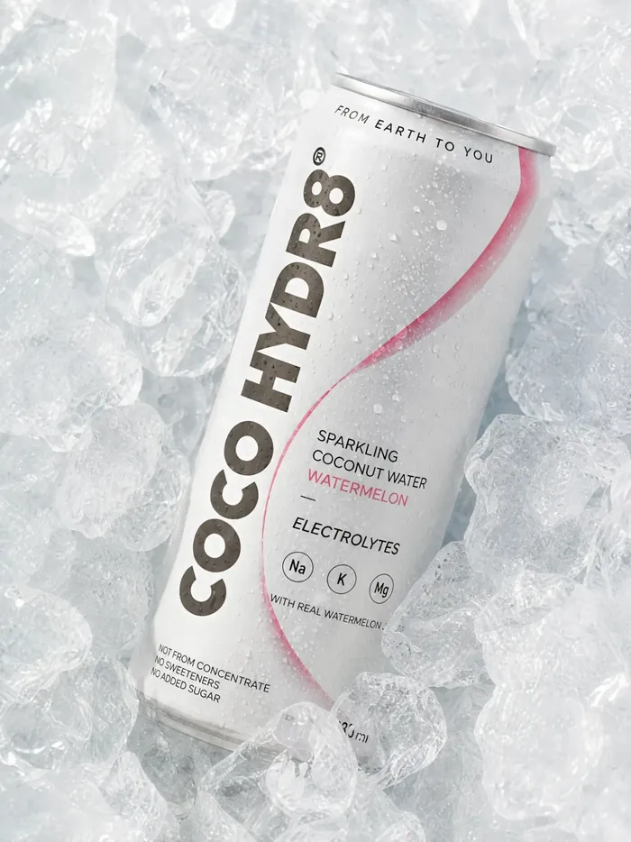 A can of COCO HYDR8 Watermelon pressed into a bed of crushed ice